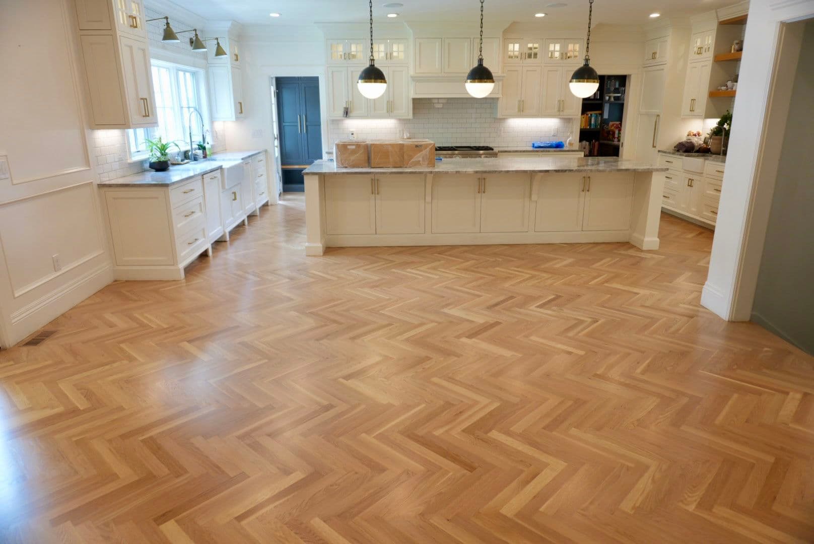White Oak Herringbone Hardwood Floors Spanning an Entire Home image